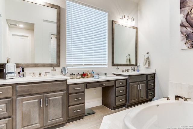 full bath featuring tile patterned flooring, visible vents, vanity, and a bath