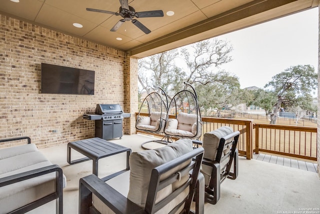 view of patio / terrace with ceiling fan, grilling area, and an outdoor living space