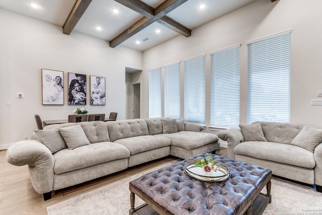 living room with beamed ceiling, wood finished floors, and recessed lighting