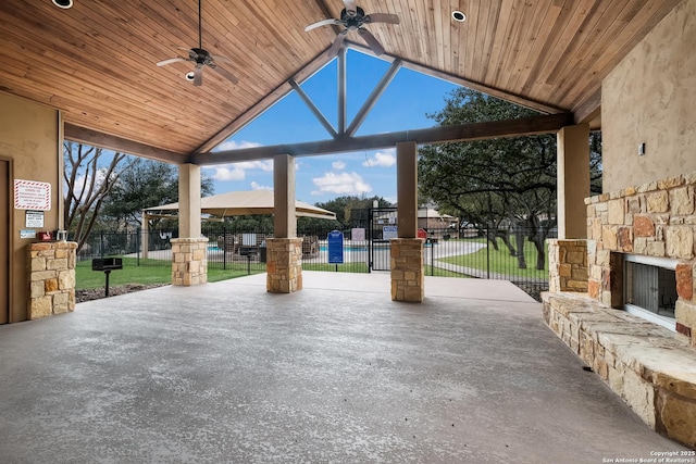 view of patio with a ceiling fan and fence