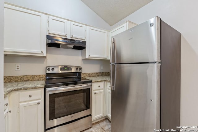 kitchen with stainless steel appliances, lofted ceiling, white cabinets, a textured ceiling, and under cabinet range hood