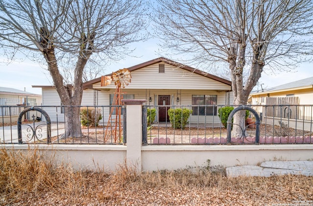 view of front of house with a porch and a fenced front yard