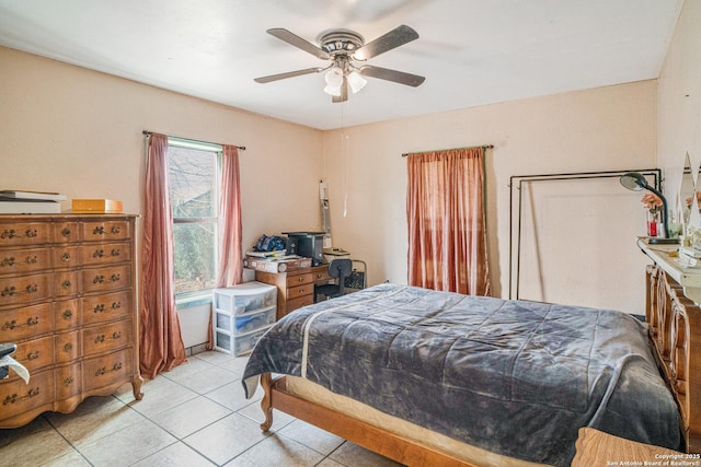 bedroom featuring a ceiling fan and light tile patterned floors