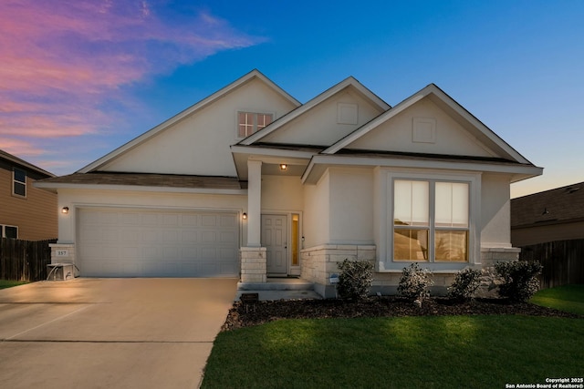 craftsman inspired home with an attached garage, fence, concrete driveway, stone siding, and stucco siding