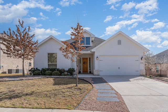 view of front of home with stucco siding, concrete driveway, an attached garage, a front yard, and cooling unit