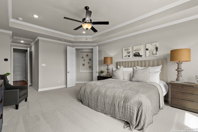 carpeted bedroom with ornamental molding, recessed lighting, a raised ceiling, and baseboards