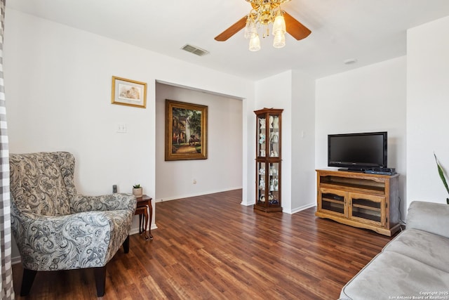 interior space featuring baseboards, ceiling fan, visible vents, and wood finished floors