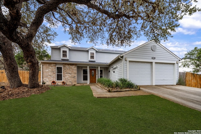 traditional-style house with a garage, brick siding, concrete driveway, fence, and a front yard