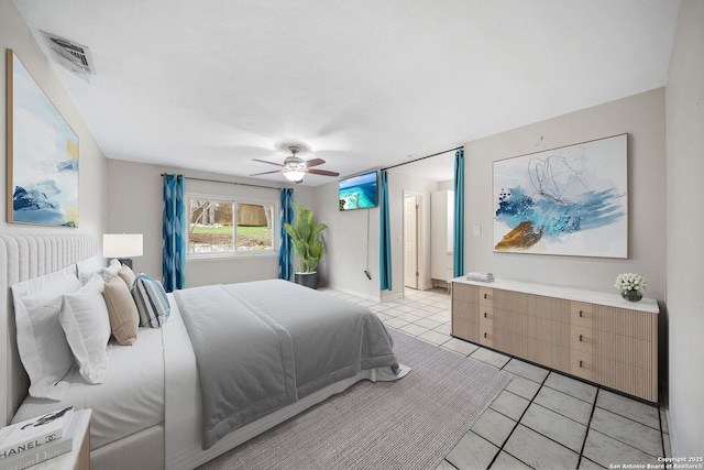 bedroom with visible vents, ceiling fan, and light tile patterned floors