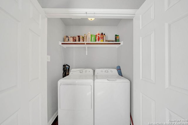 laundry room with laundry area and washing machine and clothes dryer