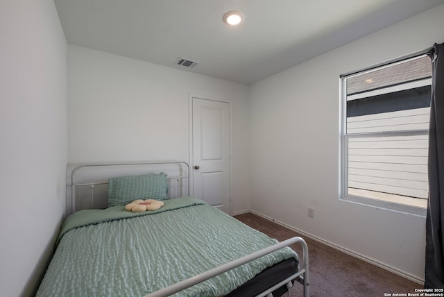 bedroom with baseboards, dark colored carpet, and recessed lighting