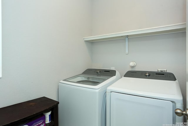 washroom with laundry area and washer and dryer