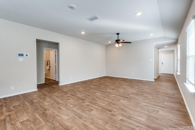 unfurnished room featuring a ceiling fan, baseboards, visible vents, and light wood finished floors