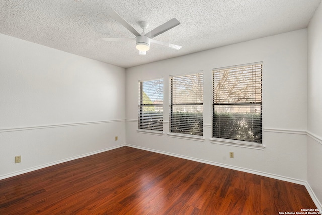 unfurnished room featuring ceiling fan, a textured ceiling, baseboards, and wood finished floors