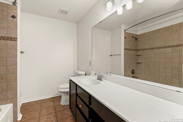 bathroom featuring visible vents, toilet, tub / shower combination, a textured ceiling, and tile patterned floors