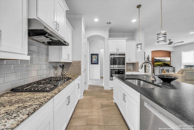 kitchen with ceiling fan, under cabinet range hood, a sink, visible vents, and appliances with stainless steel finishes