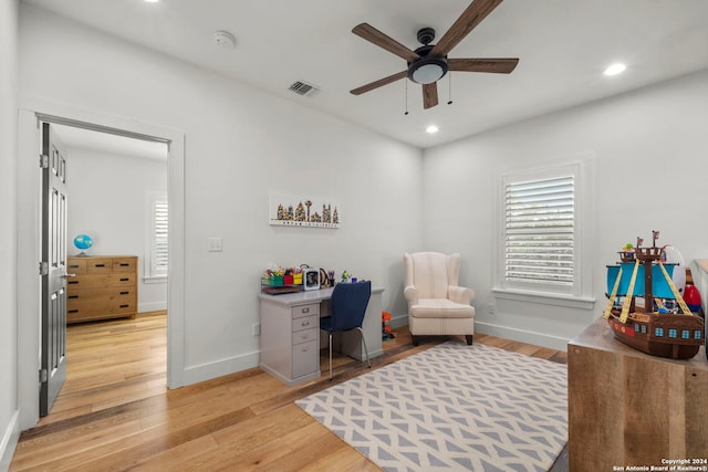 office featuring light wood-style flooring, visible vents, and recessed lighting