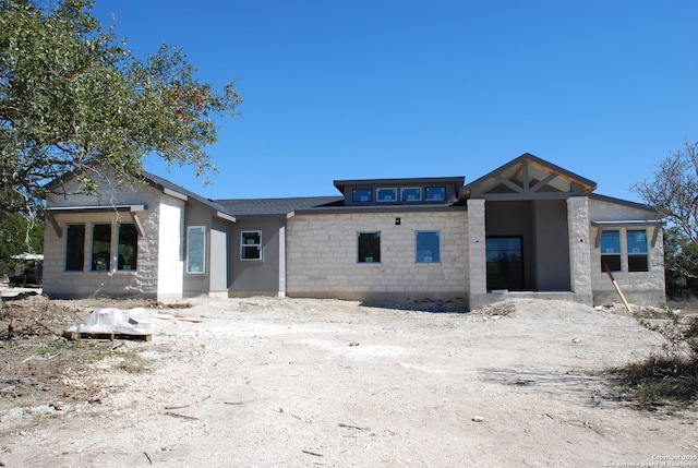 view of front facade featuring stone siding