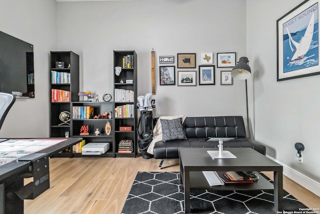 living room with wood finished floors and baseboards