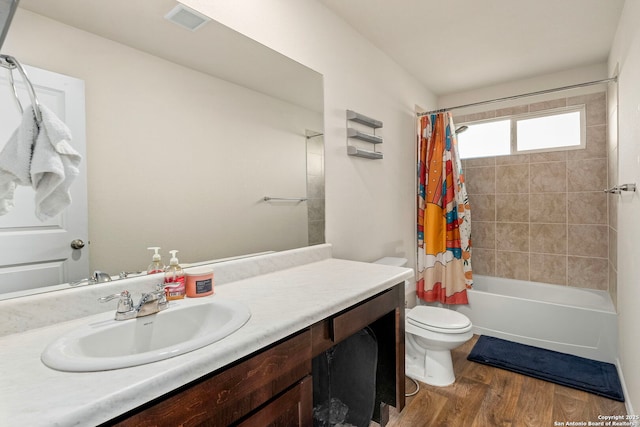 full bath with shower / tub combo with curtain, visible vents, toilet, vanity, and wood finished floors