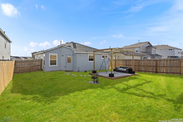 rear view of house with a yard, a patio area, a fenced backyard, and a residential view