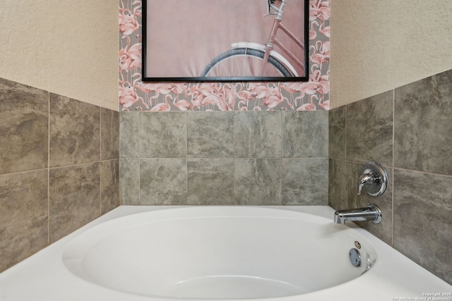 bathroom featuring a washtub