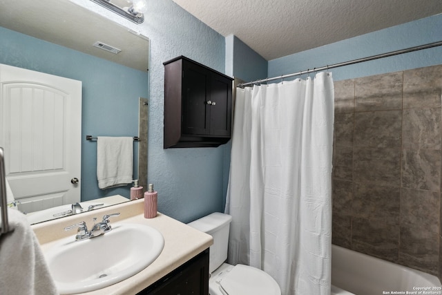 bathroom featuring visible vents, a textured wall, toilet, a textured ceiling, and vanity