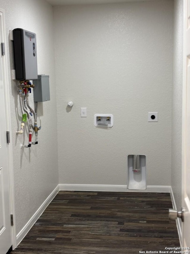 washroom featuring hookup for a washing machine, laundry area, dark wood-type flooring, baseboards, and electric dryer hookup