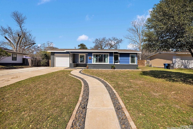 view of front facade featuring driveway, a garage, a front lawn, and brick siding