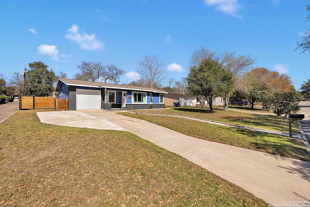 ranch-style home with a garage, concrete driveway, fence, and a front lawn