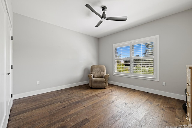 unfurnished room with a ceiling fan, baseboards, and hardwood / wood-style floors