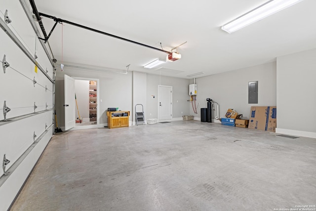 garage with electric panel, tankless water heater, and a garage door opener