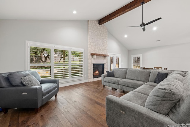 living room with high vaulted ceiling, recessed lighting, a fireplace, beam ceiling, and hardwood / wood-style floors