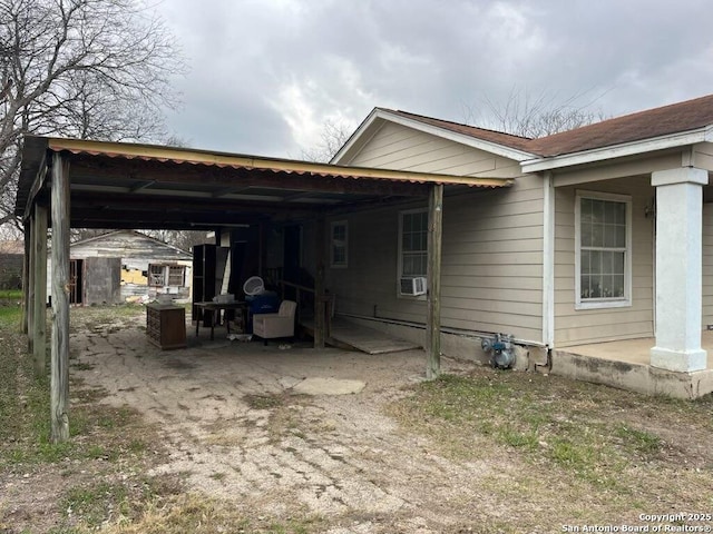 view of property exterior with a carport