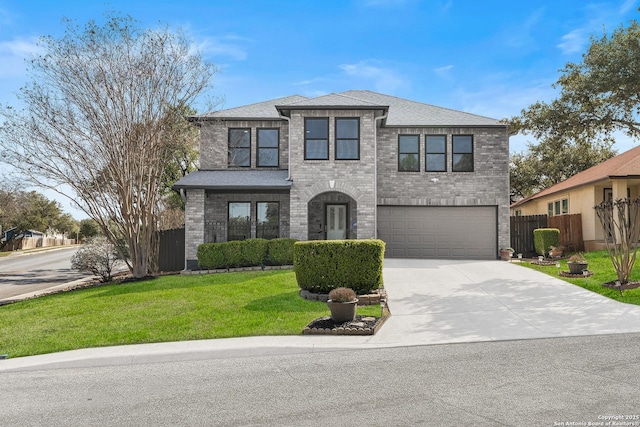 view of front of home featuring brick siding, an attached garage, fence, driveway, and a front lawn