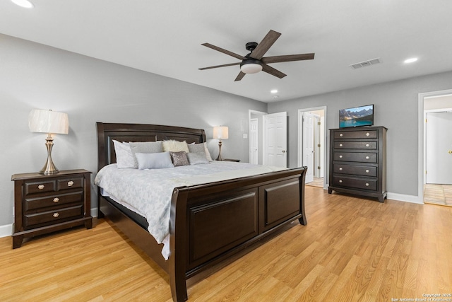 bedroom featuring recessed lighting, visible vents, light wood-style floors, a ceiling fan, and baseboards