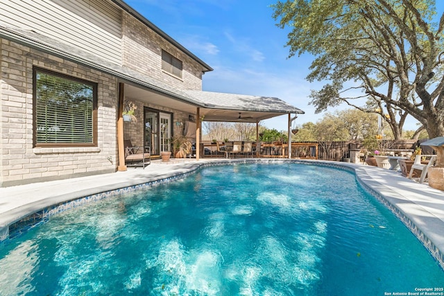 view of swimming pool with a fenced in pool, a patio area, and fence