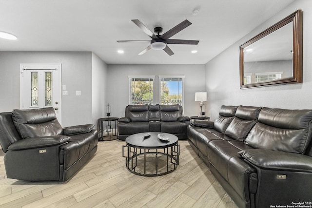 living room with ceiling fan, recessed lighting, and light wood-style floors