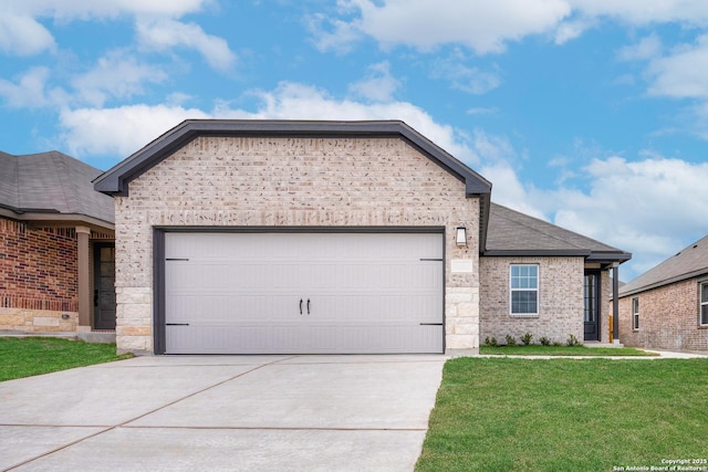 ranch-style home with brick siding, concrete driveway, an attached garage, stone siding, and a front lawn