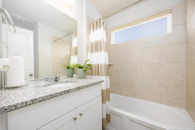 full bath featuring shower / tub combo and vanity