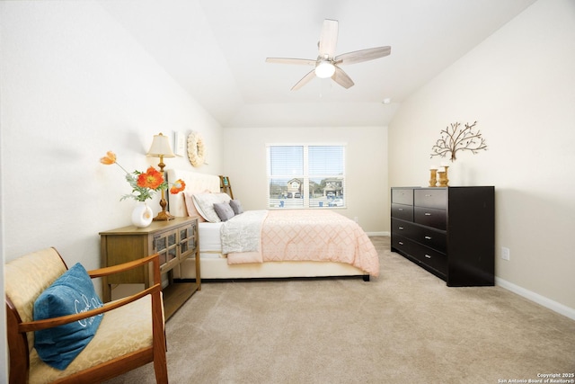 carpeted bedroom featuring lofted ceiling, ceiling fan, and baseboards