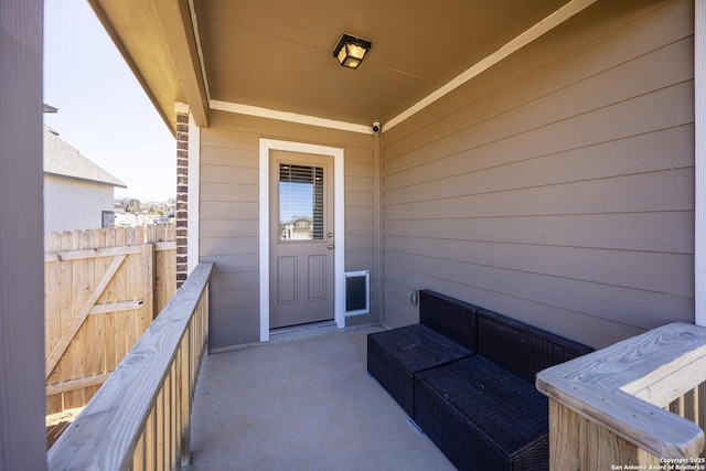 doorway to property with a balcony and an outdoor hangout area