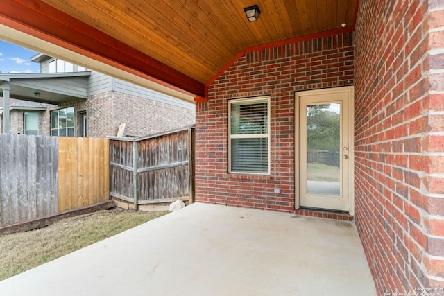 view of patio featuring fence