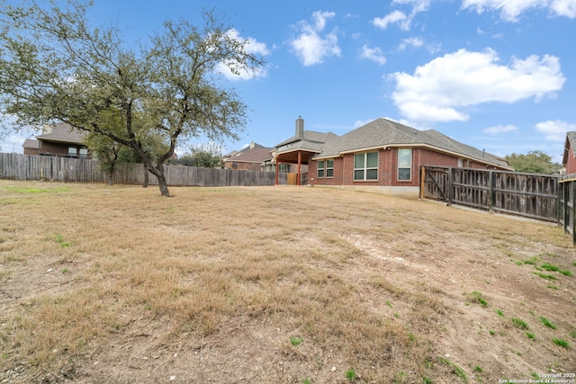 view of yard featuring a fenced backyard