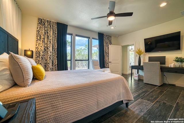 bedroom featuring recessed lighting, wood finish floors, a ceiling fan, baseboards, and visible vents