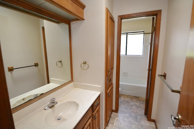 bathroom featuring baseboards and vanity