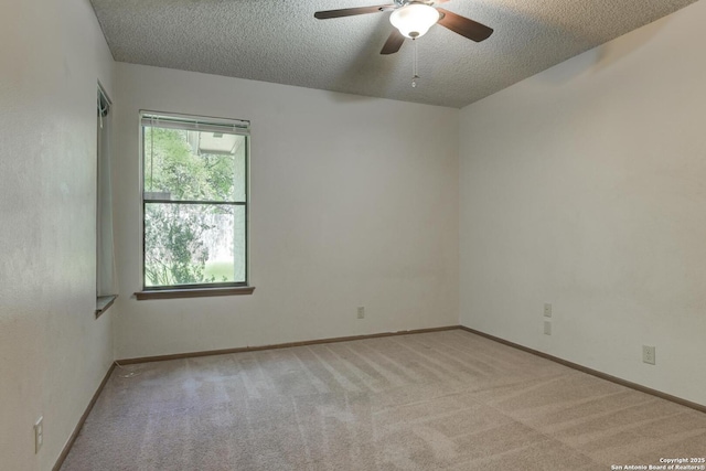 14215 Indian Woods, San Antonio, TX 78249 - carpeted spare room with ceiling fan, baseboards, and a textured ceiling