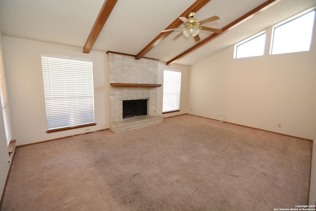 unfurnished living room with a ceiling fan, beamed ceiling, carpet flooring, a brick fireplace, and high vaulted ceiling