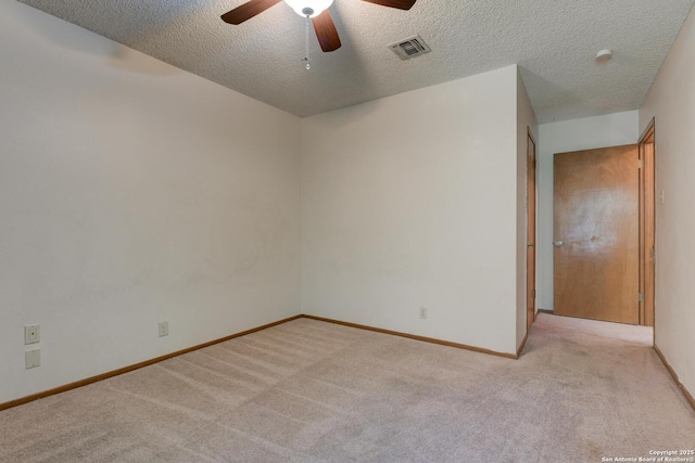 14215 Indian Woods, San Antonio, TX 78249 - unfurnished room featuring a textured ceiling, light colored carpet, a ceiling fan, visible vents, and baseboards