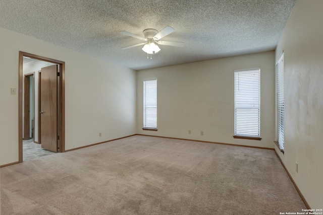 14215 Indian Woods, San Antonio, TX 78249 - unfurnished room featuring baseboards, light colored carpet, a textured ceiling, and ceiling fan